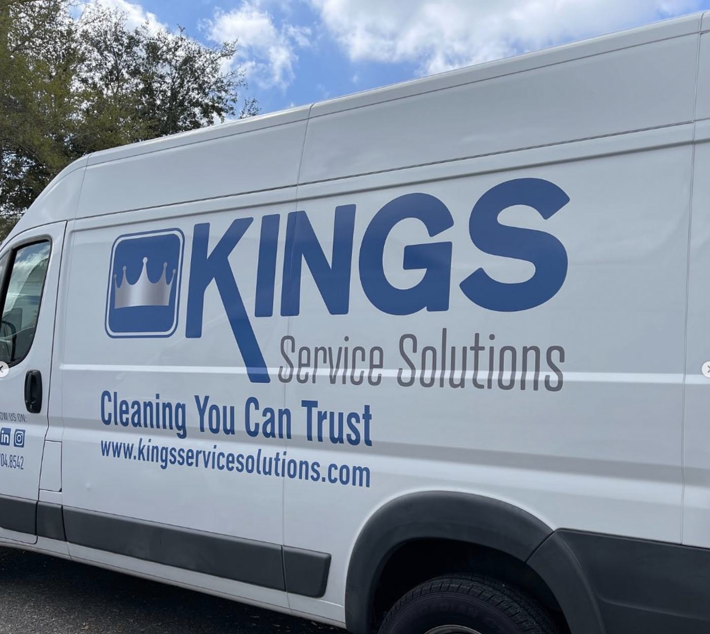 White Kings Service Solutions van with the crown logo and phone number
