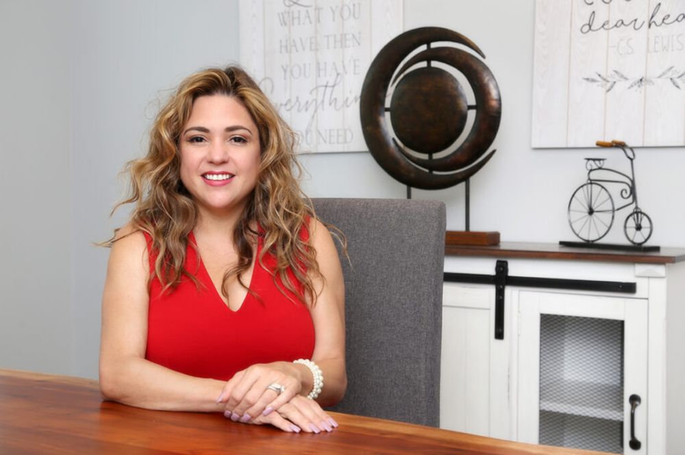 Yanet Herrero, founder and CEO of Kings Service Solutions, at her desk